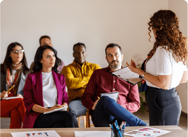 Woman presenting to attentive group