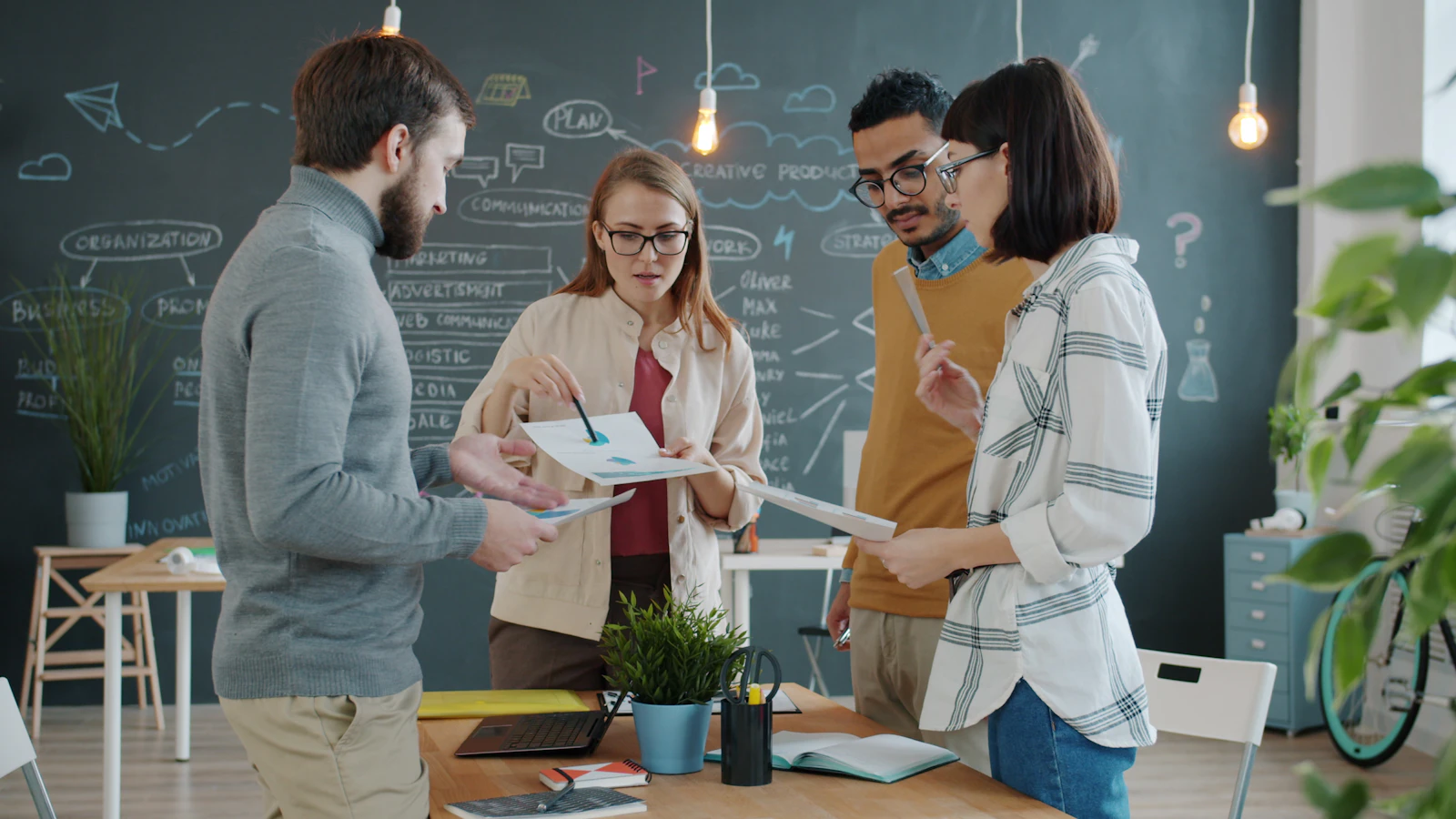 Colleagues reviewing documents together in a modern office